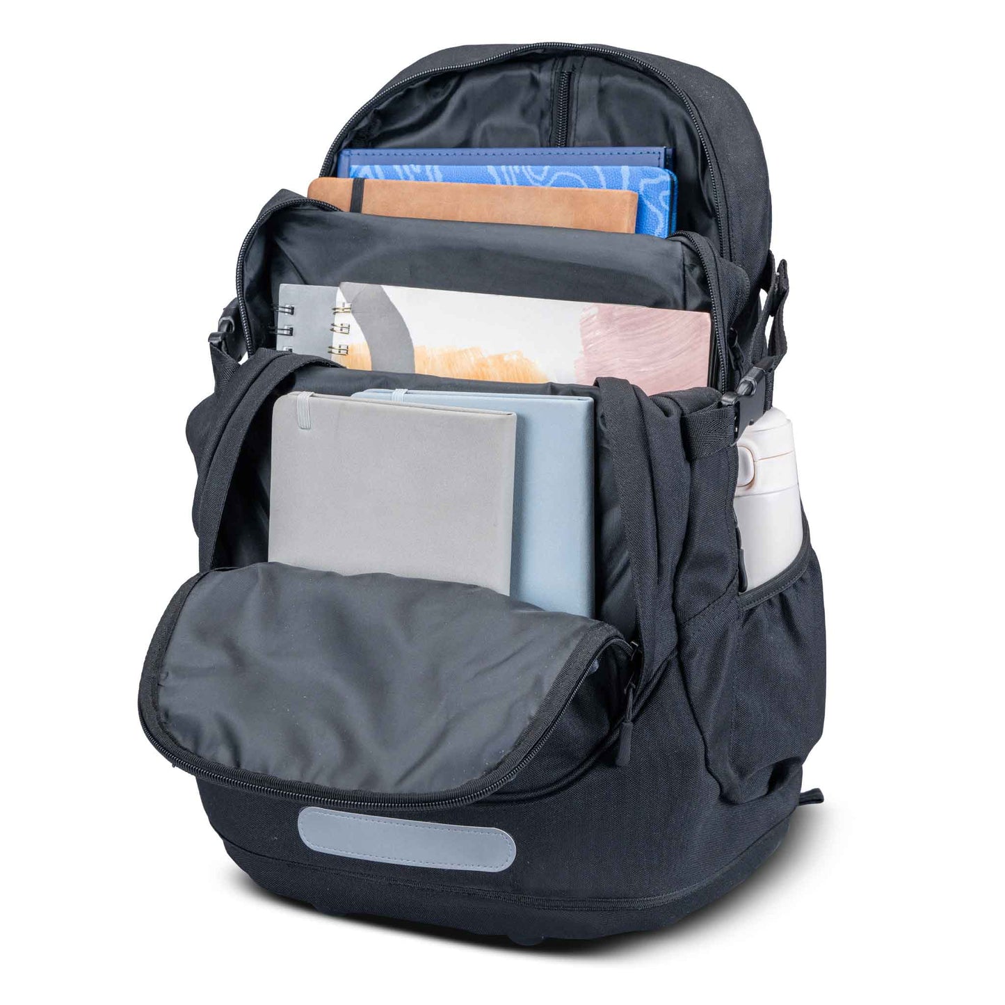 Black nylon backpack open showing multiple compartments packed with notebooks, folders, and a water bottle, with reflective base strip