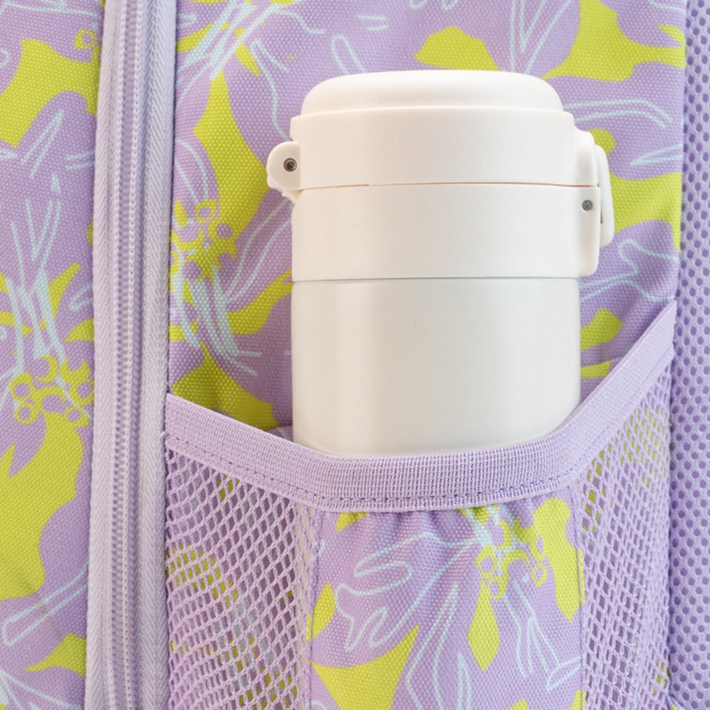 White stainless steel insulated food jar in lavender floral backpack mesh side pocket