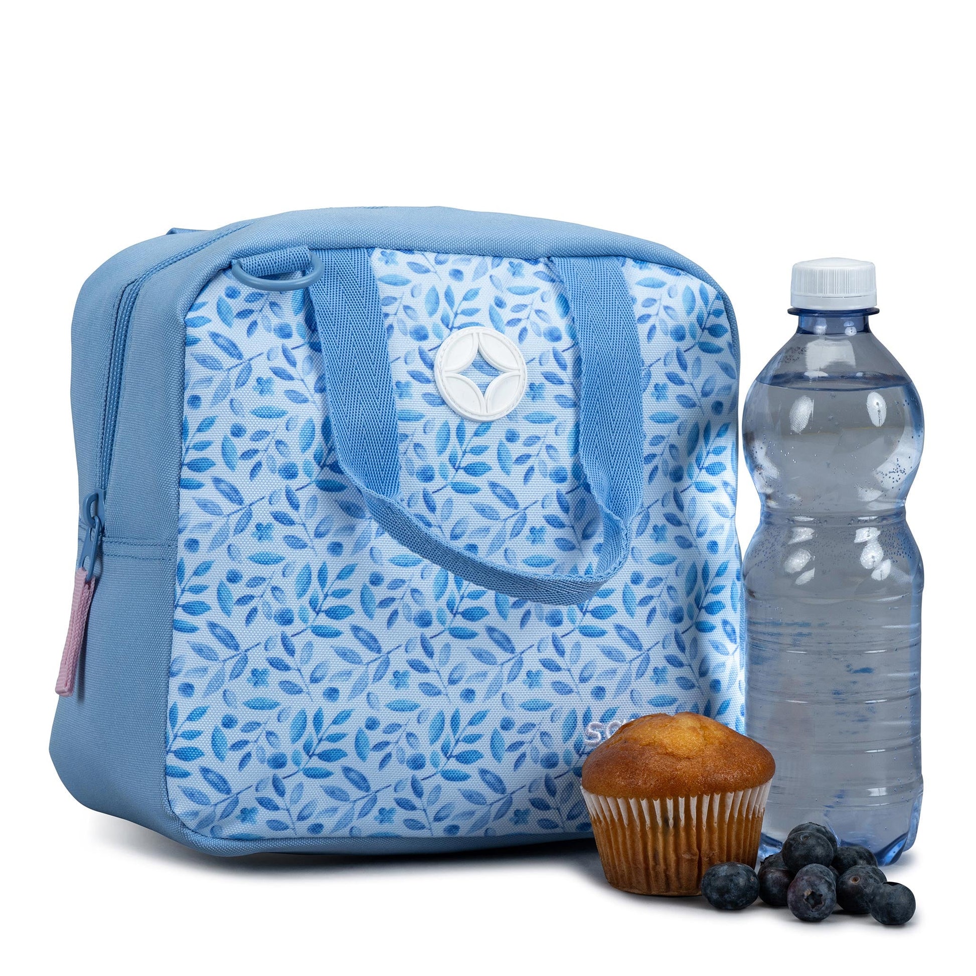 Insulated lunch bag in blue with white and blue leaf print, carry handles, zip closure, styled with muffin and water bottle
